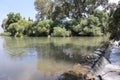 A mirror image of the Jordan River in the Kfar Blum Dam in Israel Royalty Free Stock Photo