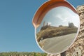 mirror at a junction of the Molina de AragÃÂ³n road, part of the local castle is reflected