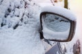 Mirror of machine of car in to snow Royalty Free Stock Photo