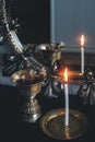 Mirror magick witchcraft - scrying with a white lit burning candle to read the flame. A reflection of skinny candle stick