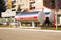 Mirror-polished Tank in the city at a gas station. The inscription in Russian propane is flammable Royalty Free Stock Photo