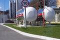 Mirror-polished Tank in the city at a gas station. The inscription in Russian propane is flammable Royalty Free Stock Photo