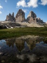 Mirror pond reflection of Tre Cime di Lavaredo alpine mountain panorama in Dolomites South Tyrol Italy alps Europe Royalty Free Stock Photo