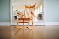 a mirror reflecting an empty rocking chair moving by itself