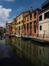 Mirror reflection of charming picturesque historic colourful house facades in Venice canals Venezia Veneto Italy Europe