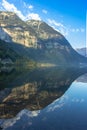 Mirror reflection in Hallstatter See,Austria. Summer spring colors lake and mountain at sunrise in Austrian Alps.Beautiful