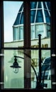 Mirror reflection of a street lamp in the window. Royalty Free Stock Photo