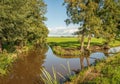 Mirror smooth reflecting water surface of Dutch polder ditches Royalty Free Stock Photo