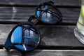 Mirror sunglasses on wooden table