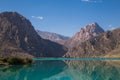 Mirror surface of Lake Iskanderkul at dawn amid the mountains Royalty Free Stock Photo