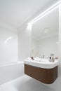 Mirror wall above modern washbasin Royalty Free Stock Photo