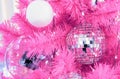 Mirrored disco balls on a pink Christmas tree