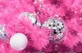 Mirrored disco balls on a pink Christmas tree