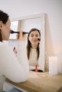 Mirrored image of a woman blushing her cheeks Royalty Free Stock Photo