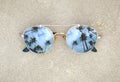 Mirrored sunglasses close up on the beach sand with palm trees reflection Royalty Free Stock Photo