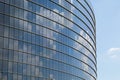 Mirrored windows of the modern skyscraper with the reflection of the sky Royalty Free Stock Photo
