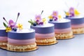 mirrorglazed blueberry entremets neatly arranged in a row Royalty Free Stock Photo