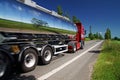 Mirroring the landscape chrome tank truck moving on a highway Royalty Free Stock Photo