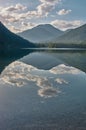 Mirroring mountain lake during sunrise in the Austrian alps Royalty Free Stock Photo