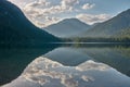 Mirroring mountain lake during sunrise in the Austrian alps