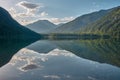 Mirroring mountain lake during sunrise in the Austrian alps Royalty Free Stock Photo