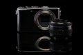 Mirrorless camera body and lens.Isolated on black background. Royalty Free Stock Photo