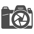 Mirrorless camera solid icon, photography concept. Vector graphics. Photocamera sign on white background, glyph style