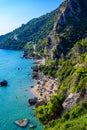 Mirtiotissa beach with crystal clear azure water and white beach in beautiful landscape scenery - paradise coastline of Corfu Royalty Free Stock Photo