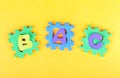 Misaligned puzzle, ABC alphabet letters in wrong order, shapes, toy pieces put in wrong holes, wrong places. Children, kids Royalty Free Stock Photo