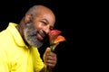 Mischievous African American holds lily flowers on black background. Diversity, Mothers Day, Love or Valentines Day concept