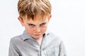 Mischievous bully child expressing revenge, retaliation or attitude problem, isolated