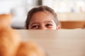 Mischievous Girl Wearing School Uniform Taking Croissant From Kitchen Counter