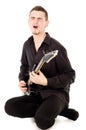 Mischievous guy plays the electric guitar Royalty Free Stock Photo