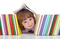 Mischievous kid with freckles and books Royalty Free Stock Photo
