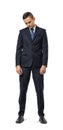 Miserable businessman full-height looking down isolated on the white background. Royalty Free Stock Photo