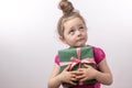 Miserable fearful beautiful girl doesn`t want to share with gift book