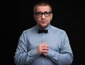 Miserable man wearing glasses and bow tie Royalty Free Stock Photo