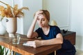 Miserable woman feeling sick with flu, having fever and blowing runny nose. Depression in a woman. Take antidepressants Royalty Free Stock Photo