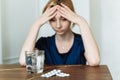 Miserable woman feeling sick with flu, having fever and blowing runny nose. Depression in a woman. Take antidepressants Royalty Free Stock Photo