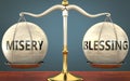 Misery and blessing staying in balance - pictured as a metal scale with weights and labels misery and blessing to symbolize