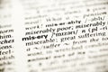 'Misery' - dictionary definition vignette Royalty Free Stock Photo