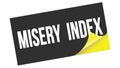 MISERY INDEX text on black yellow sticker stamp