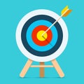 Target icon in flat style on color background. Bullseye business conpept. Arrow in the center aim. Vector design element for you p Royalty Free Stock Photo