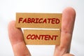 Misleading and fabricated content sign on a white Royalty Free Stock Photo