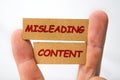 Misleading and fabricated content sign on a white Royalty Free Stock Photo