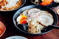 Miso Chashu Ramen: Japanese noodle in Miso soup with chashu pork, boiled egg, dry seaweed and chives in black bowl Royalty Free Stock Photo