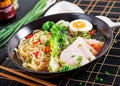 Miso Ramen Asian noodles with egg, pork and pak choi cabbage Royalty Free Stock Photo