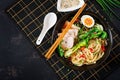 Miso Ramen Asian noodles with egg, pork and pak choi cabbage in bowl