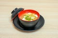 Miso soup with tofu and vegetable in black cup with lid Royalty Free Stock Photo