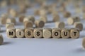 Miss out - cube with letters, sign with wooden cubes